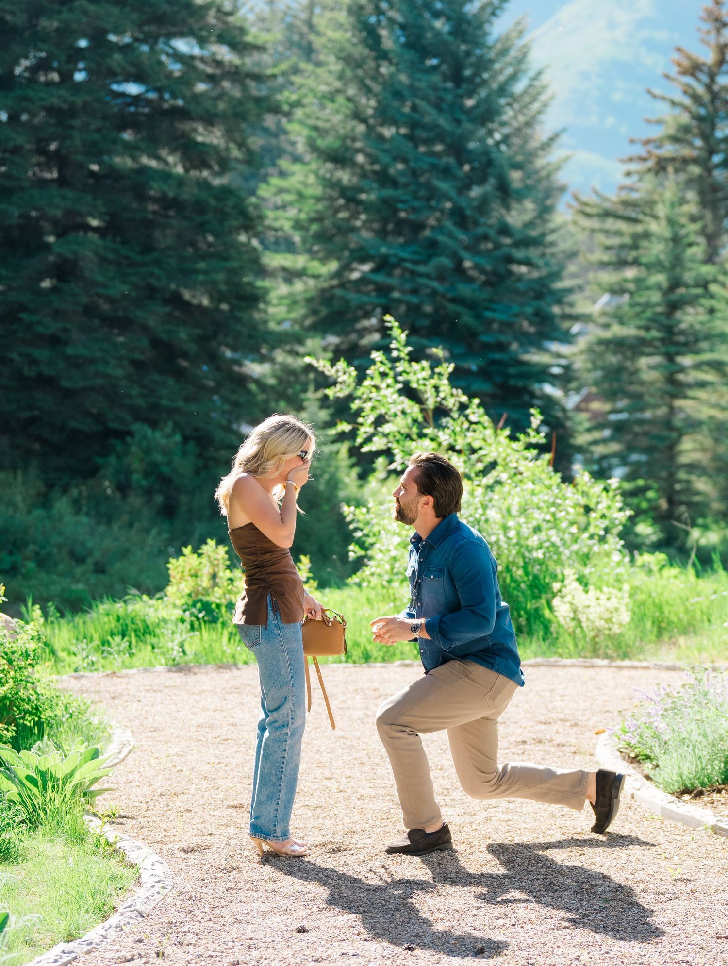 guy proposes to girlfriend by river in vail