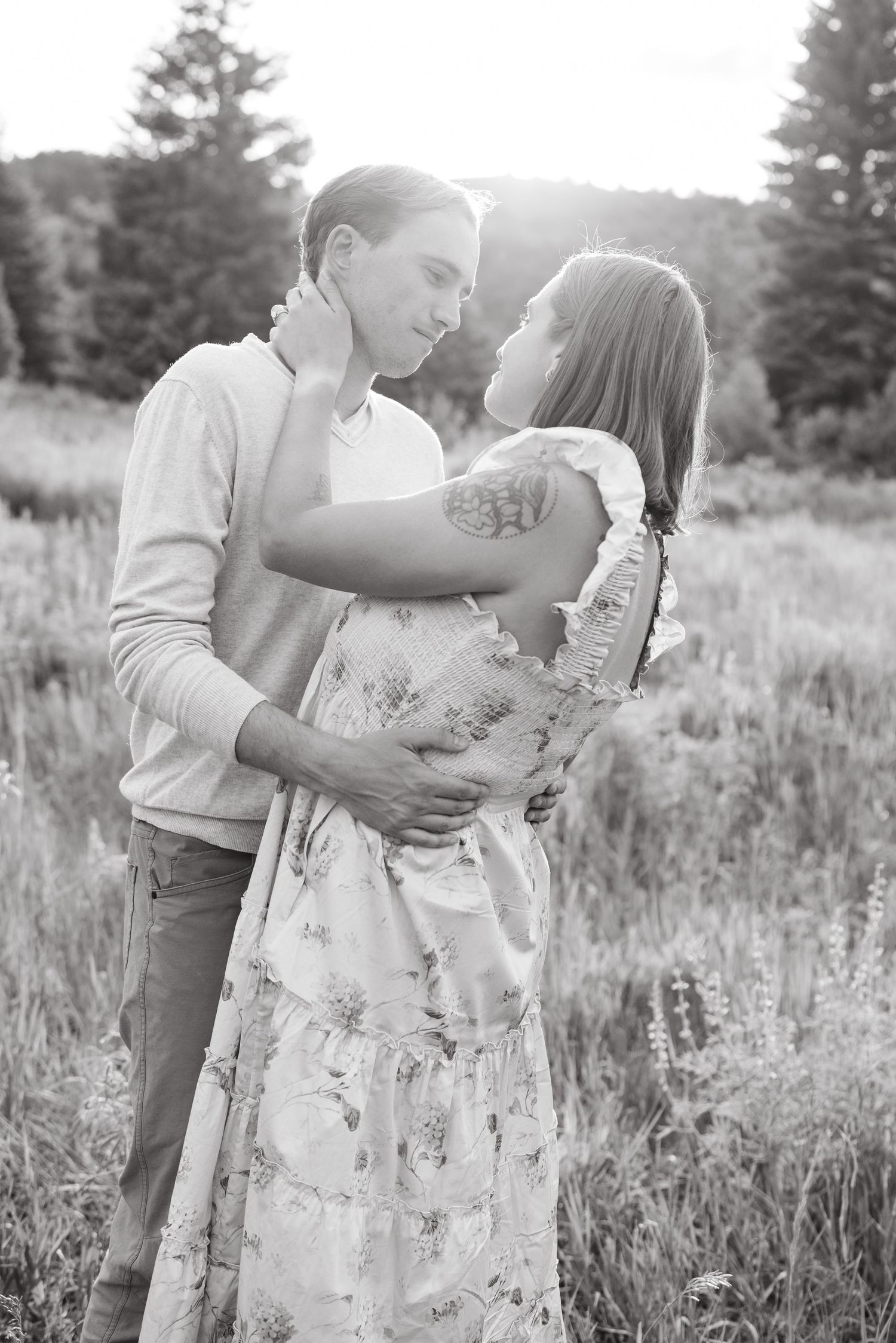 guy and girl looking at each other in mountains