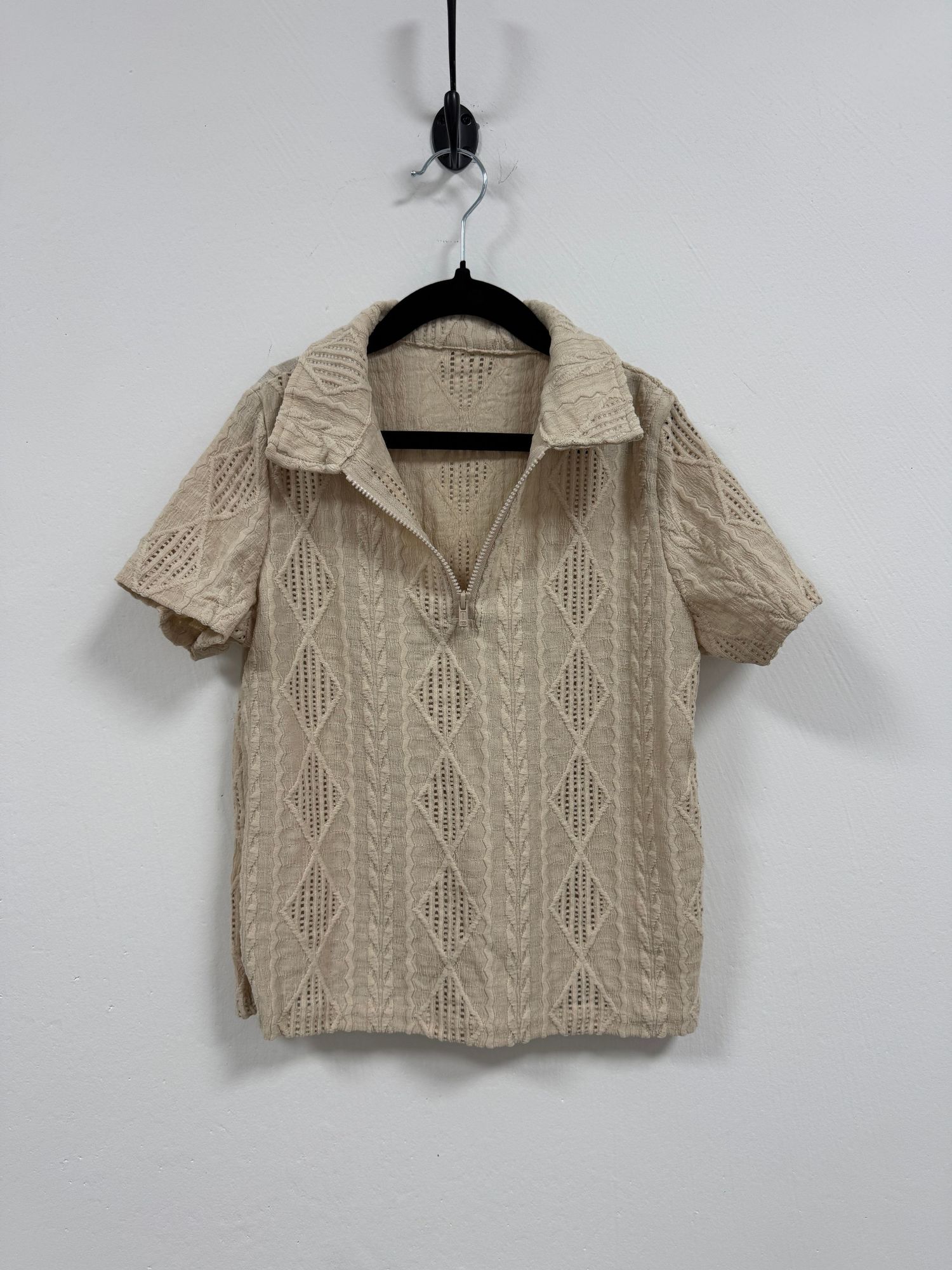 Beige knit cropped sweater with collared neckline and cable knit pattern shown from multiple angles on hangers.