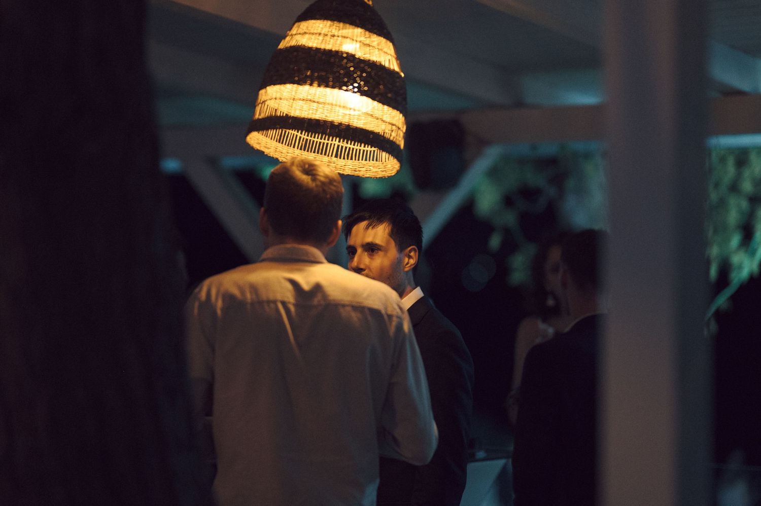 Intimate dance floor moment between two partners during a low-lit ballroom dance event.