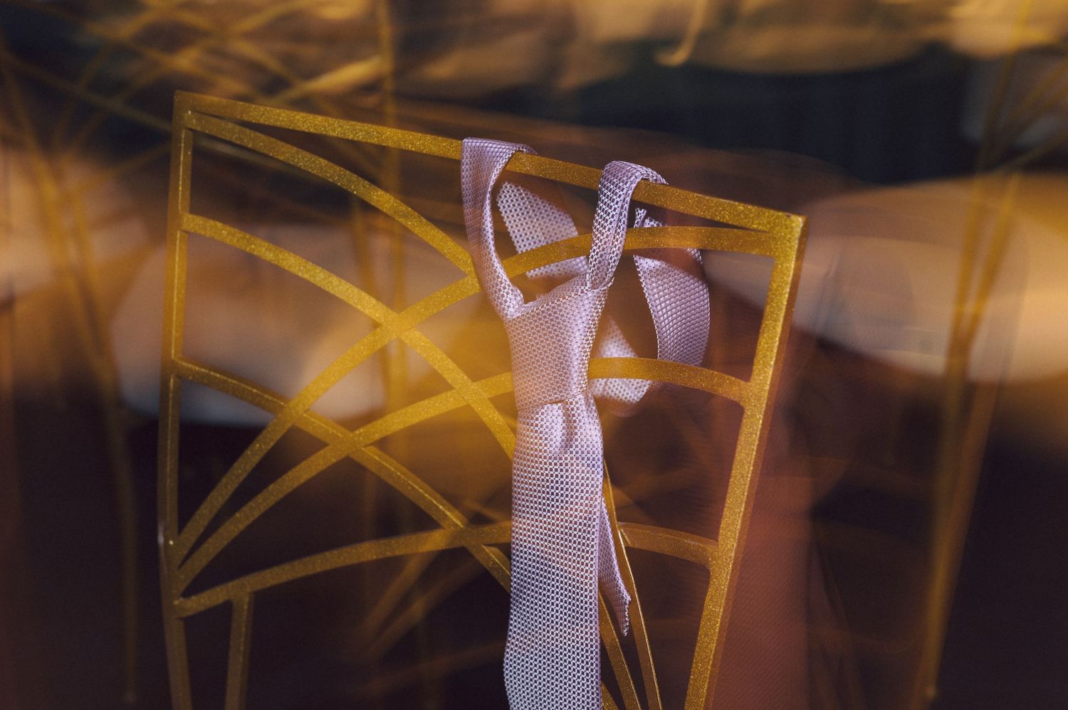 Abstract motion blur of yellow lights creating artistic streaks across a dark background.