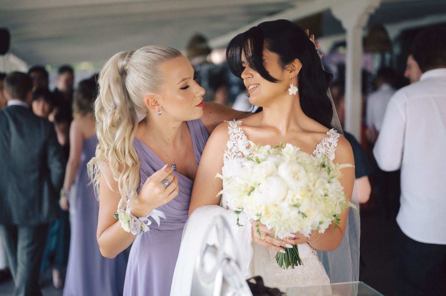 A collection of intimate wedding moments showing couples in matching outfits sharing embraces and dancing at a reception.