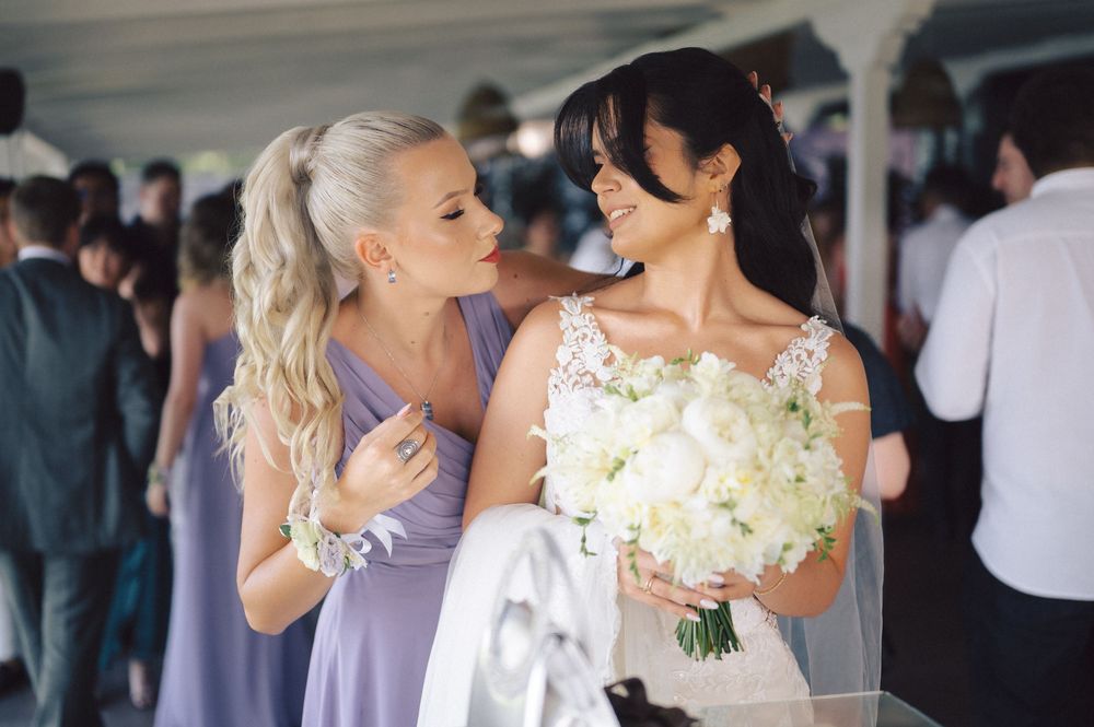 A collection of intimate wedding moments showing couples in matching outfits sharing embraces and dancing at a reception.