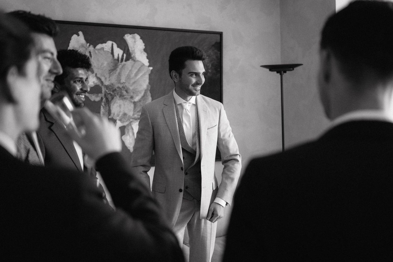 Black and white photo sequence showing a person leaning back in laughter during what appears to be a candid moment.