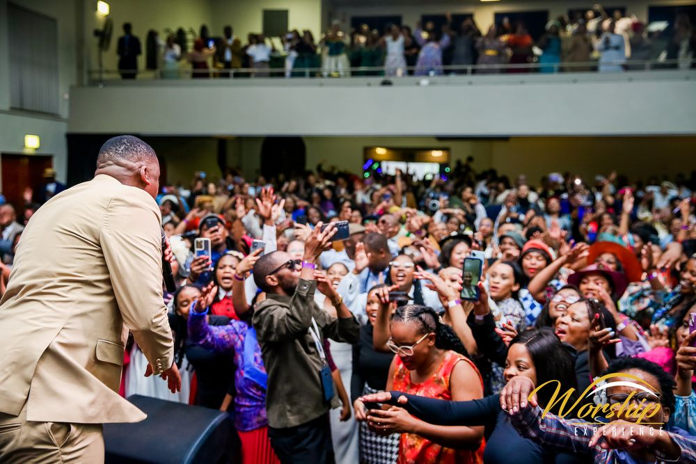 “Gospel concert crowd in worship”