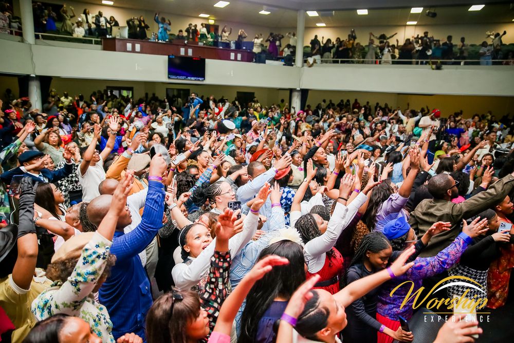 “Gospel concert crowd in worship”