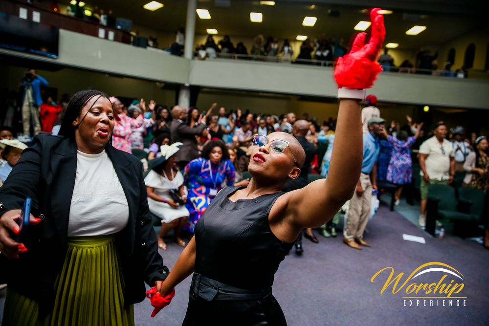 “Gospel concert crowd in worship”