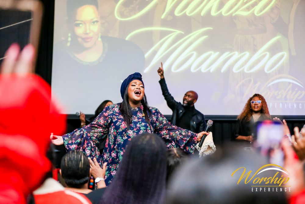 “Gospel concert crowd in worship”