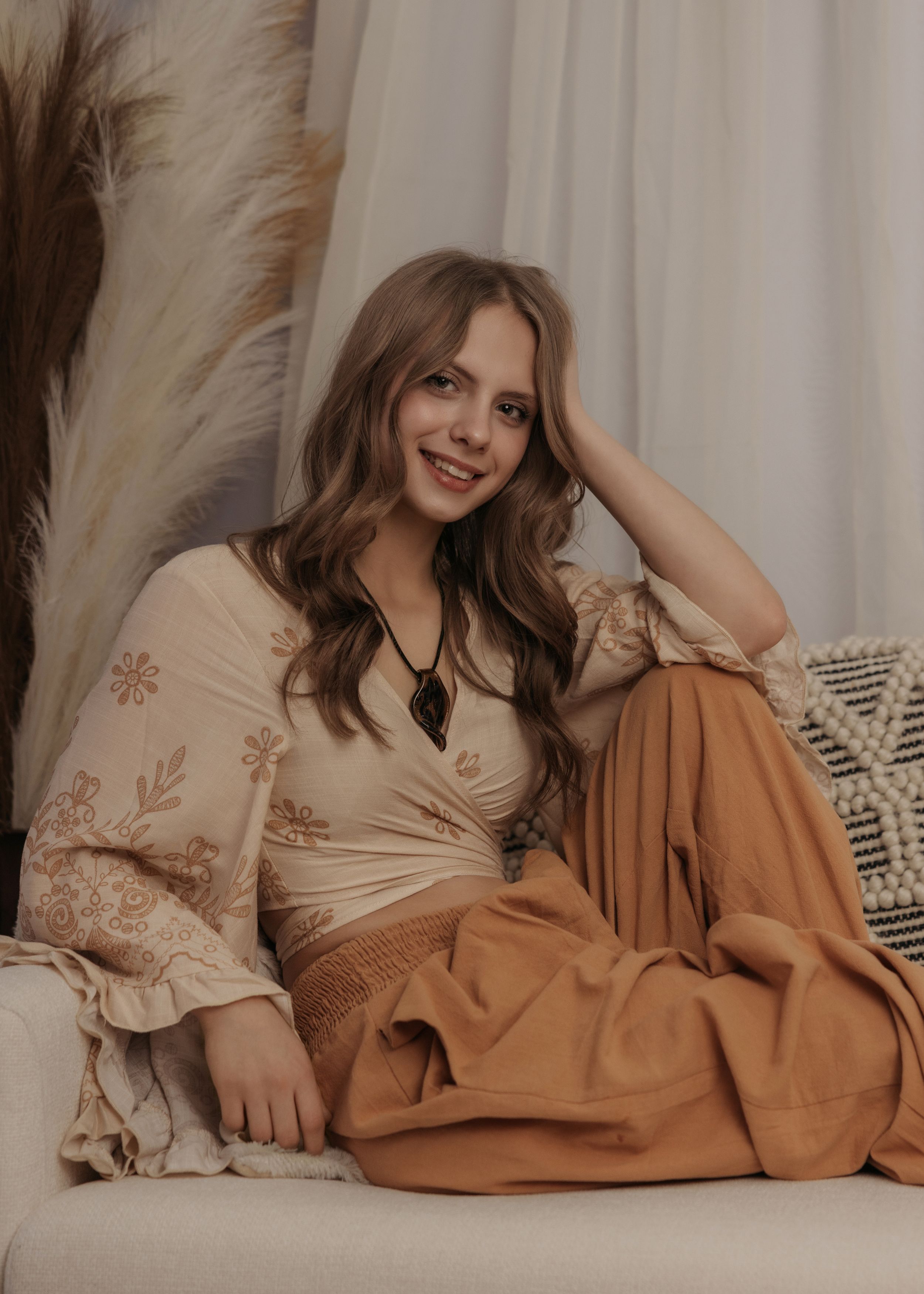 Lifestyle fashion photo series featuring warm beige and brown tones with embroidered details and cozy fabrics.