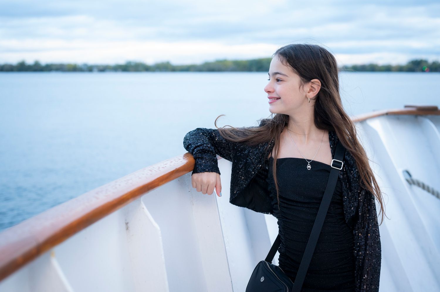Bat Mitzvah girl celebrating at a boat party on Lake Ontario.