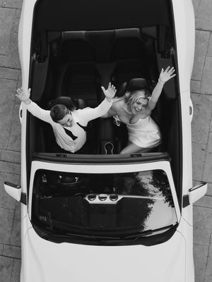 Sequence of three black and white photos showing people celebrating with raised arms in a white convertible car.