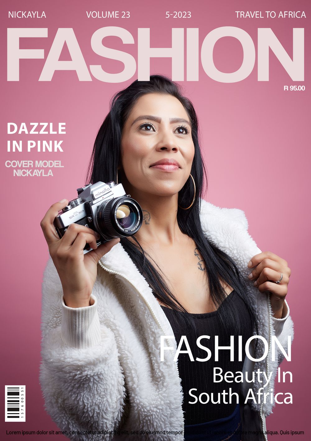 Fashion magazine cover with pink background showing photographer holding vintage camera wearing white fuzzy sweater.