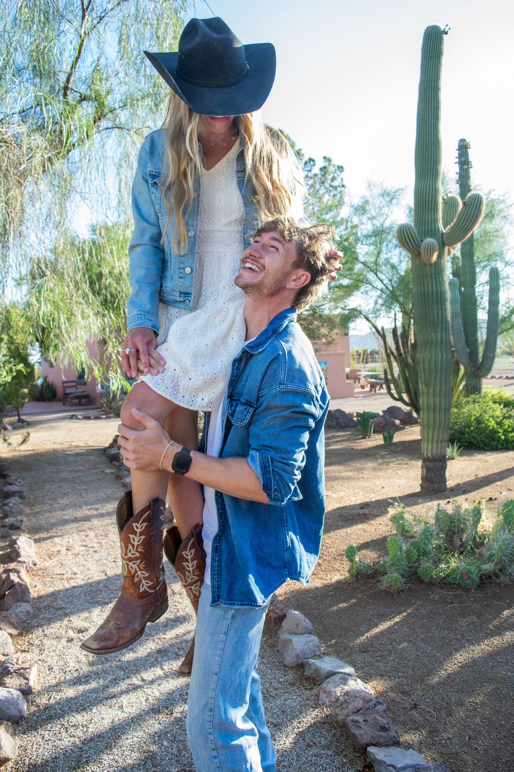 couple posing playfully together in rural Marana, Arizona at White Stallion Ranch