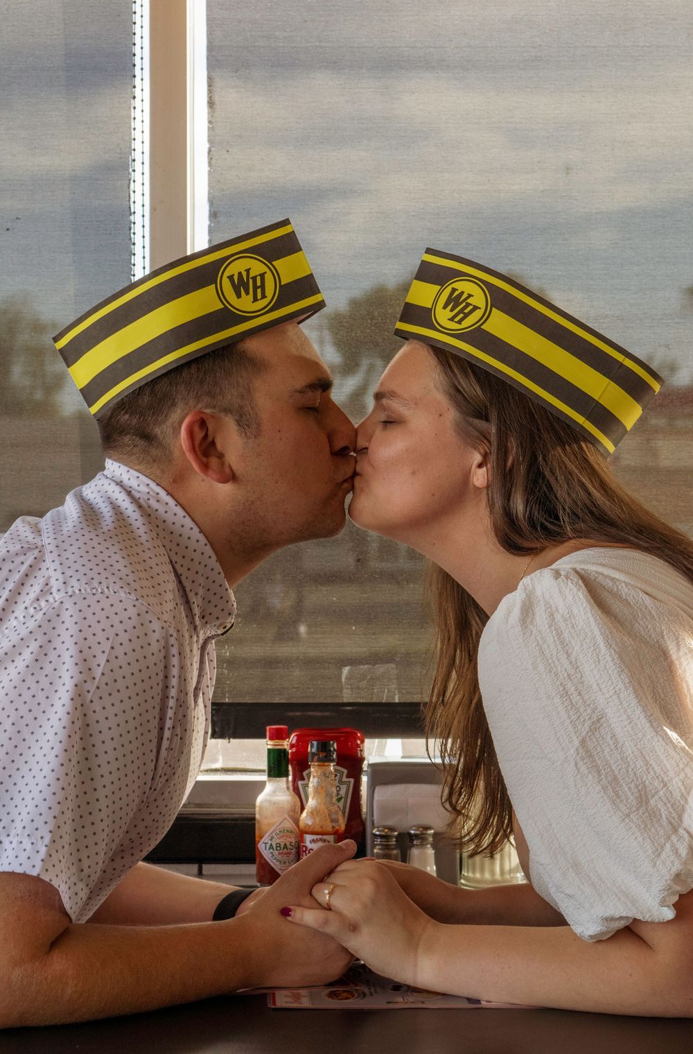 couple kissing at Waffle House in Tucson Arizona