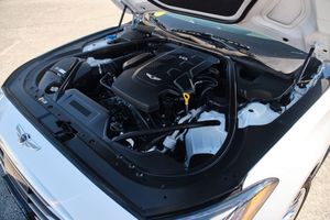 Under the hood view of a modern Hyundai vehicle showing the engine bay and components in a clean engine compartment.