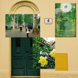 A green door, yellow mailbox, and collage of photos featuring a tree-lined path and yellow flowers mounted on a wall.
