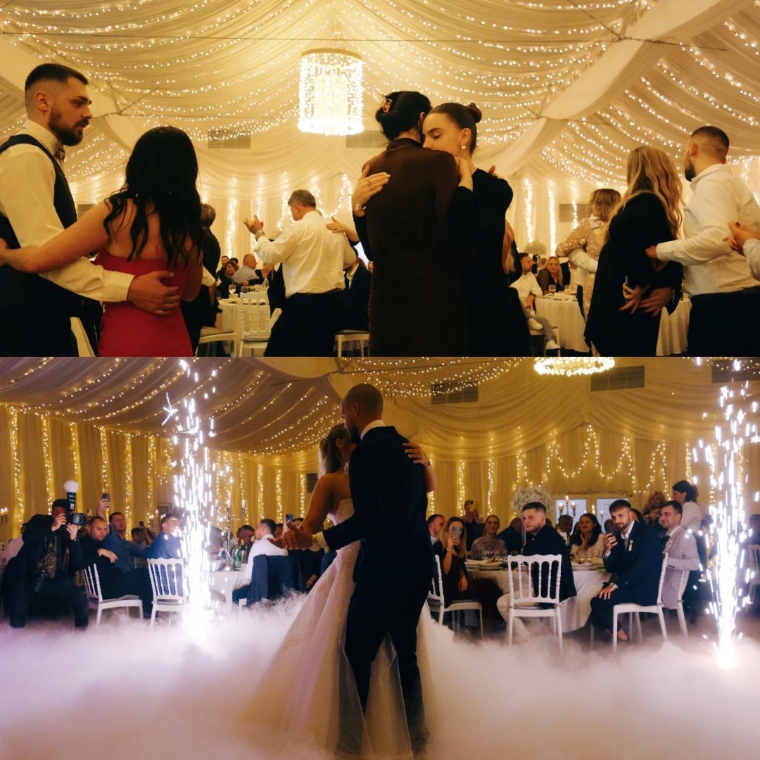 Couples dancing at an elegant wedding reception under draped white fabric ceiling with sparkling indoor fireworks display.
