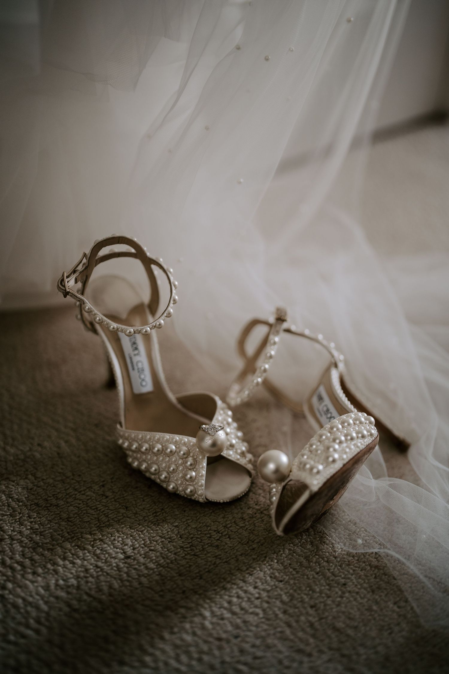 jimmy choose and wedding ring during bride preparation at the new inn cirencester