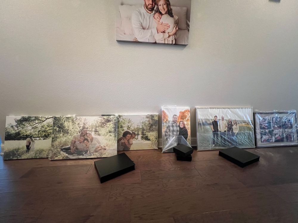 A panoramic view of artwork displayed along gallery walls in a modern exhibition space.