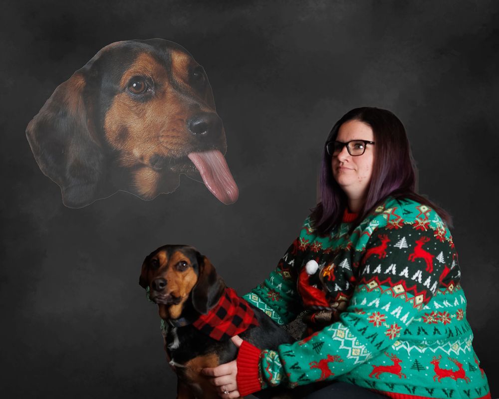 Holiday portrait featuring someone in a festive green sweater with their black and brown dachshund and floating dog head effect.