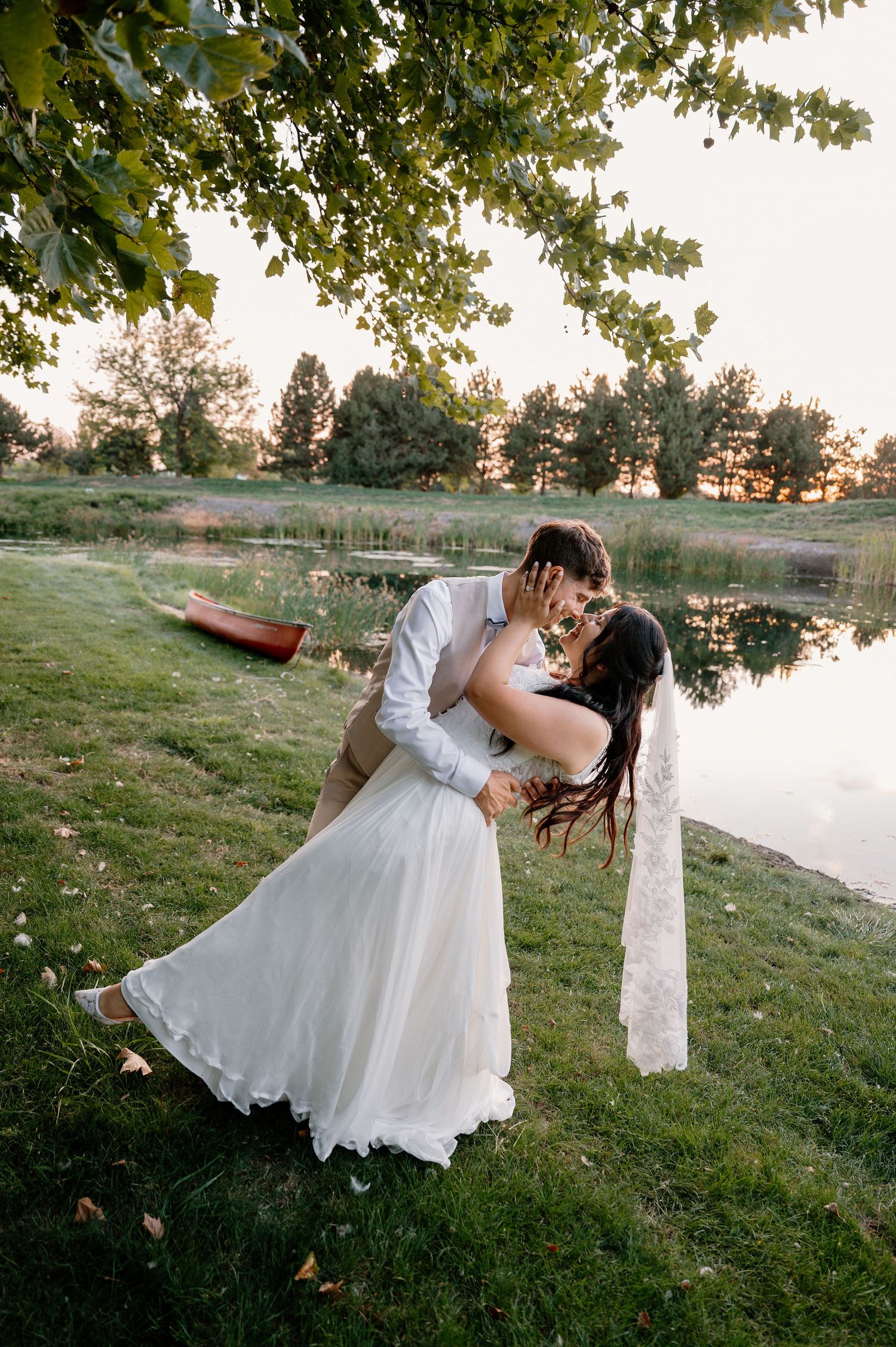Outdoor wedding portraits near a pond in Oregon at sunset
