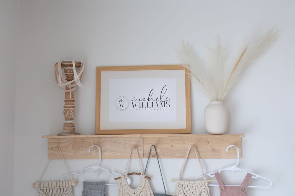 Neutral beige and white home decor collection featuring woven baskets, frames, and minimalist accessories on shelves.