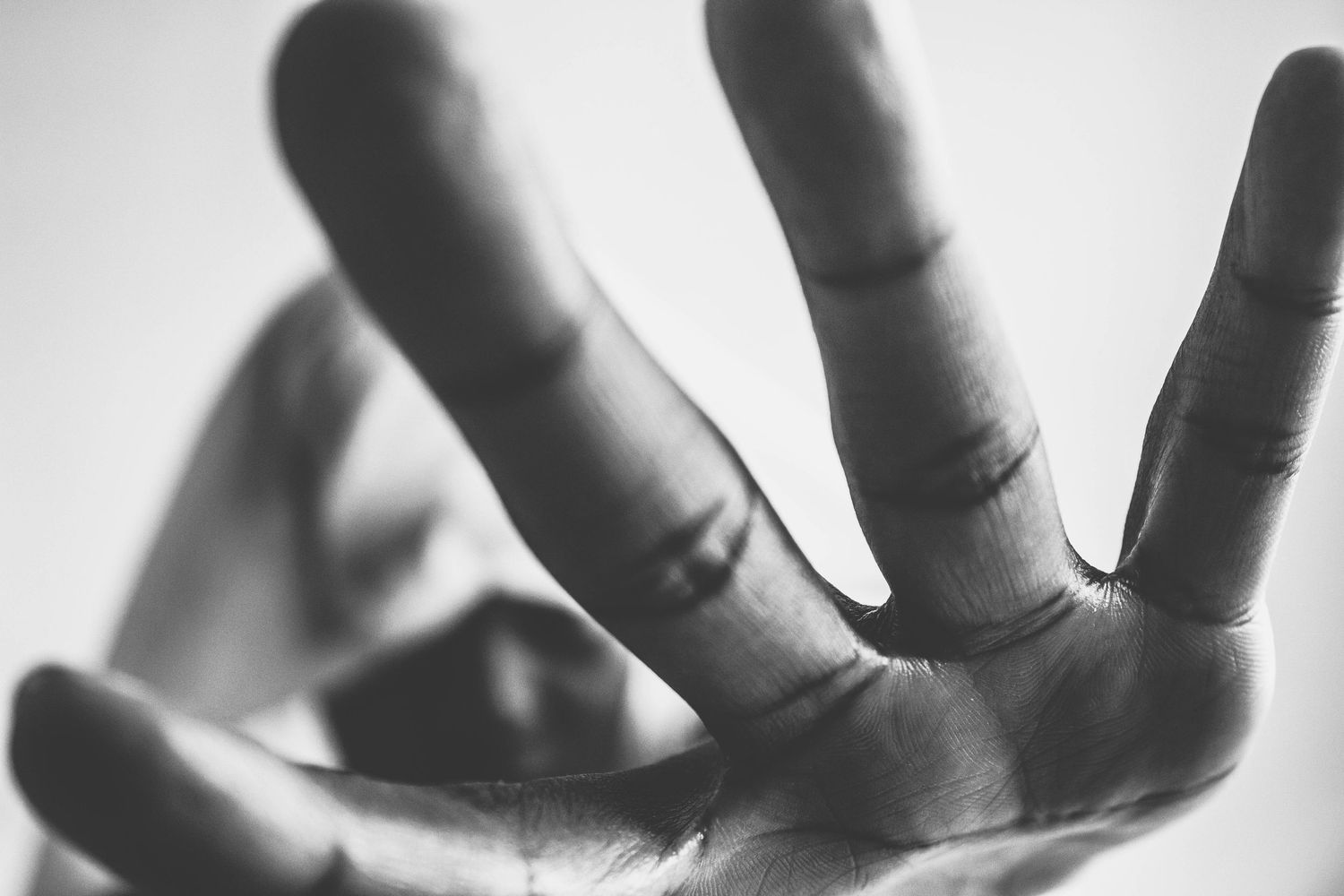 Black and white abstract photo series showing flowing fabric and dramatic light creating ethereal shapes and shadows.