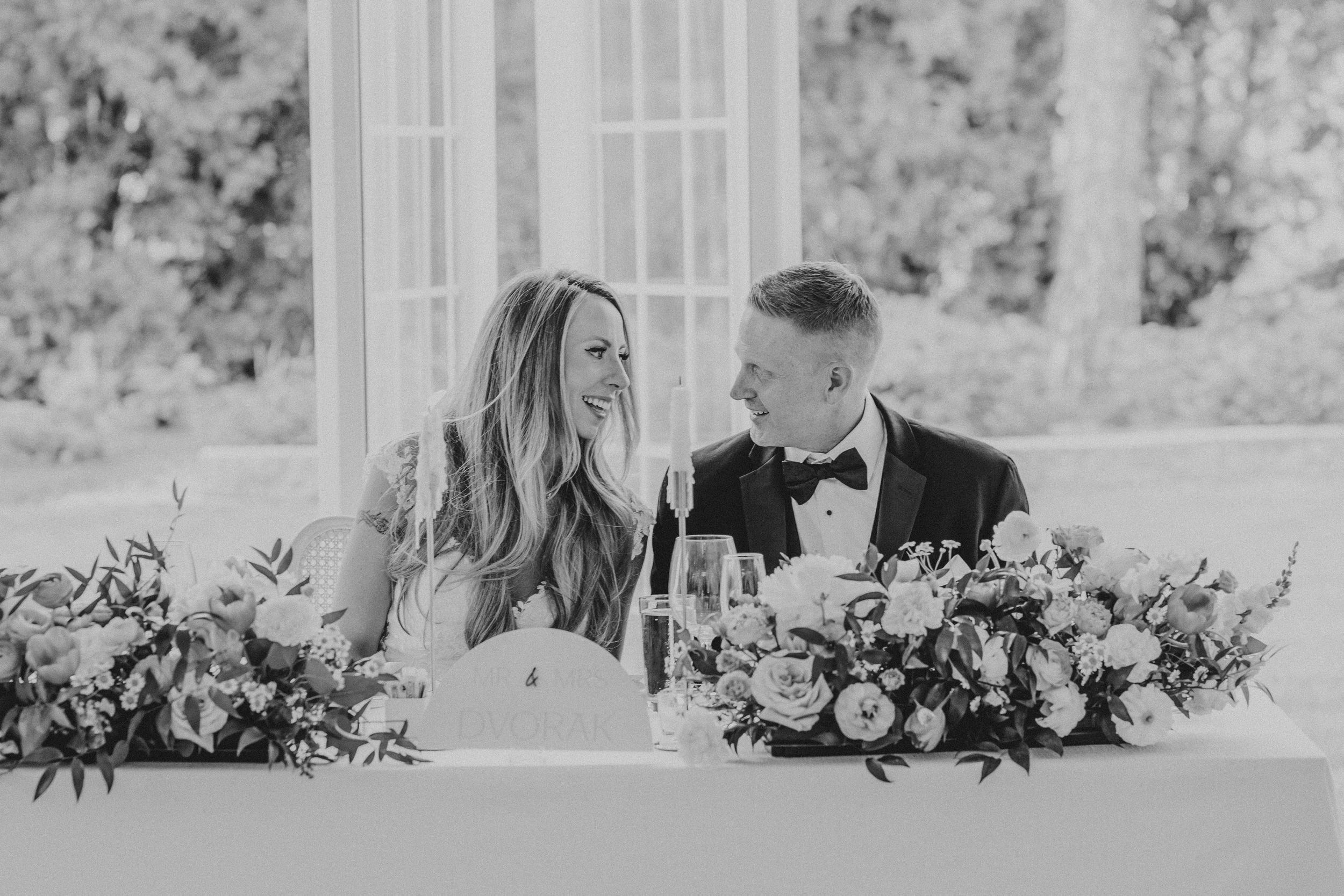 A romantic black and white wedding photo collage showing intimate moments between a couple on their special day.