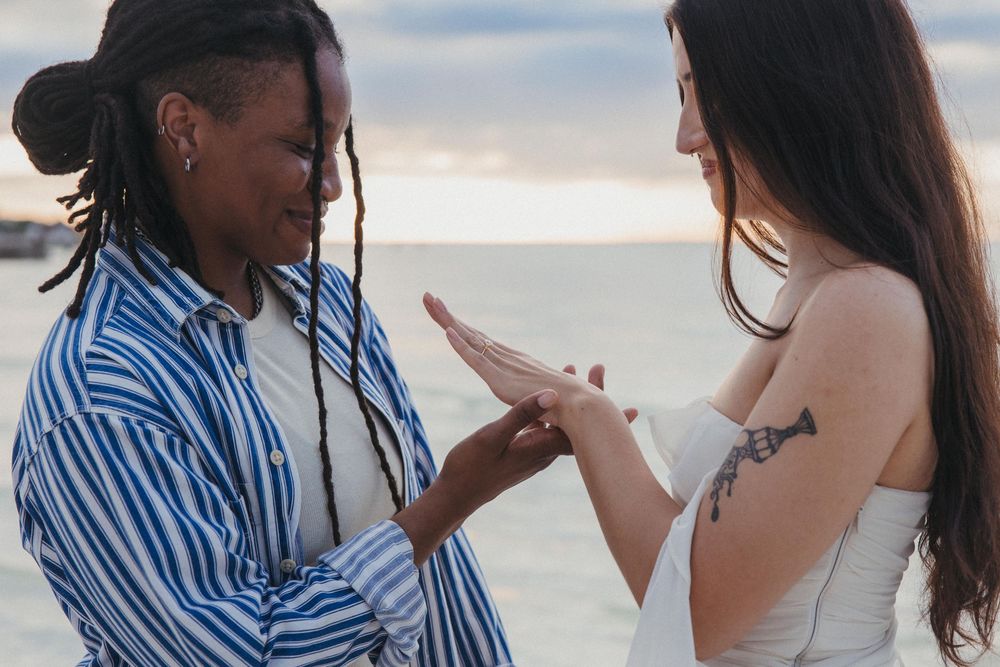 A couple shares a romantic moment on the beach of Holbox at sunset after a proposal shoot in Mexico