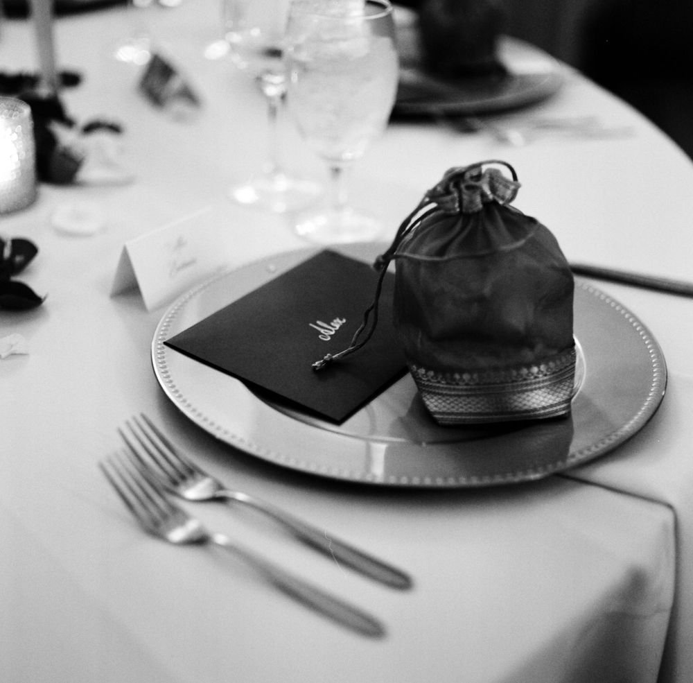 A film photo of a wedding place setting at a Cuneo Mansion wedding reception.