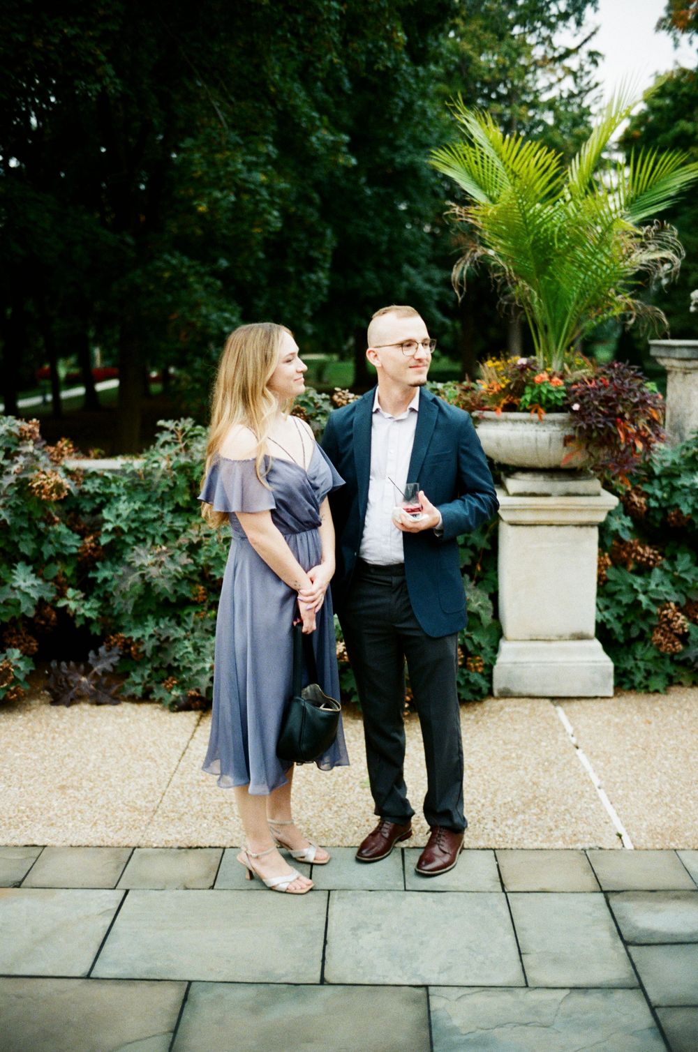 A film photo of guests at a wedding cocktail hour at Cuneo Mansion.