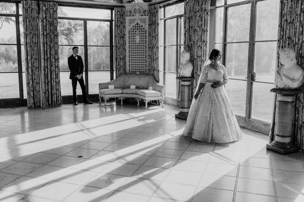 A bride and groom in the Formal Dining room at Cuneo Mansion.