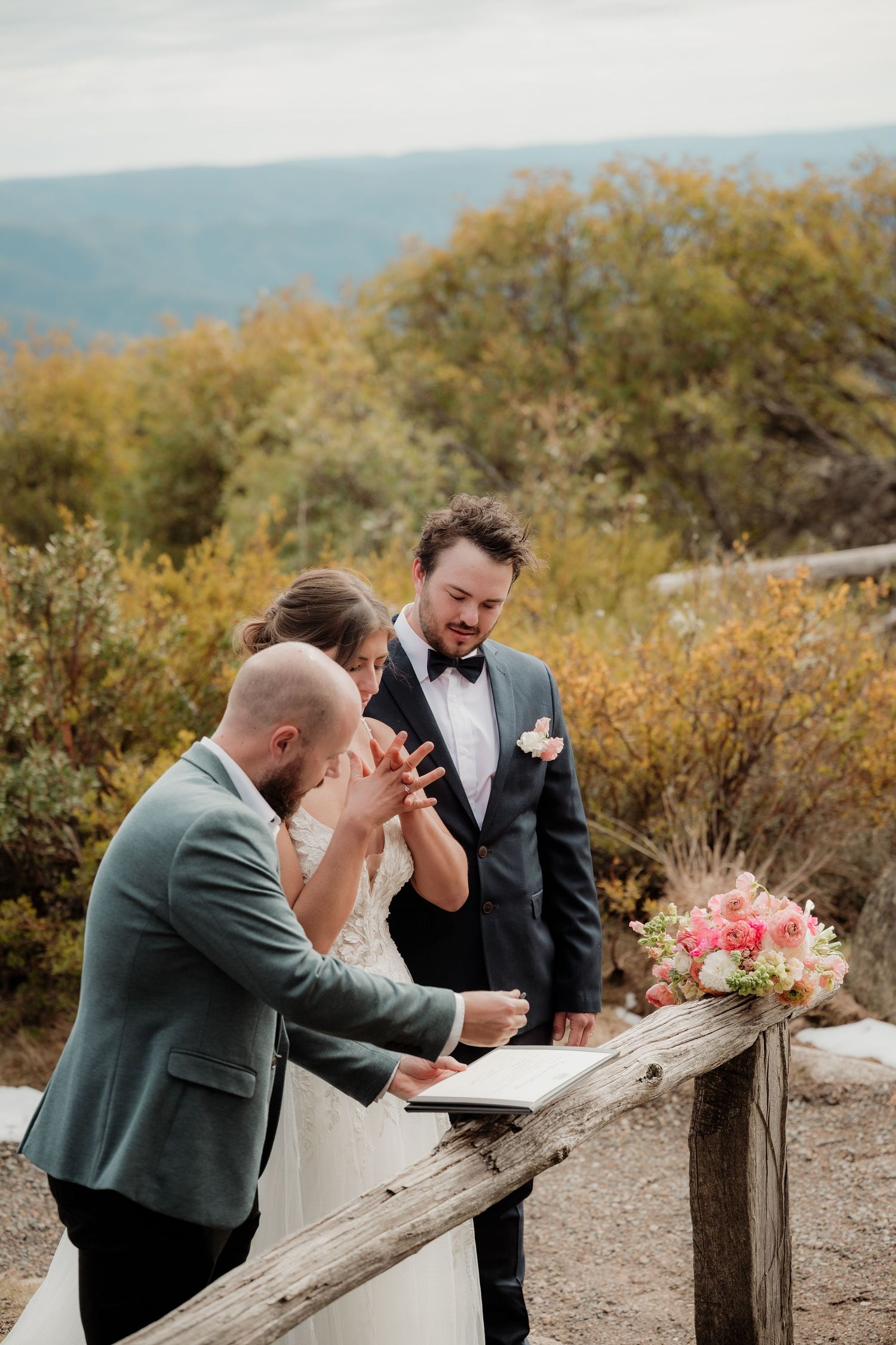 A sequence of emotional reactions captured outdoors with mountains and autumn foliage in the background.
