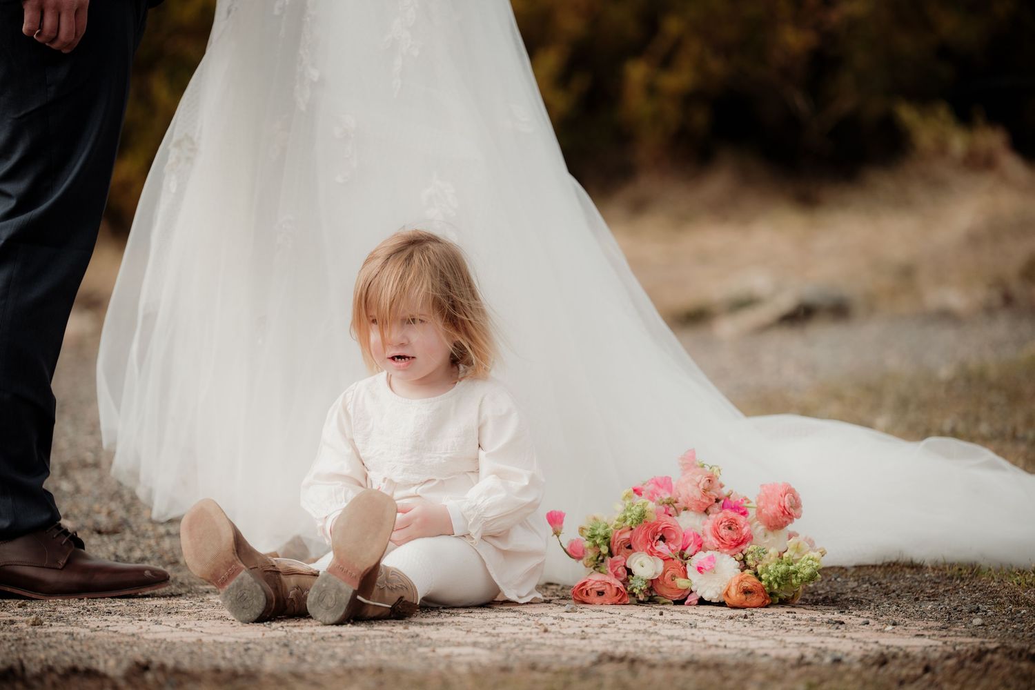 A series of wedding dress detail shots showing the hem, floral bouquet, and dress fabric against a natural outdoor backdrop.