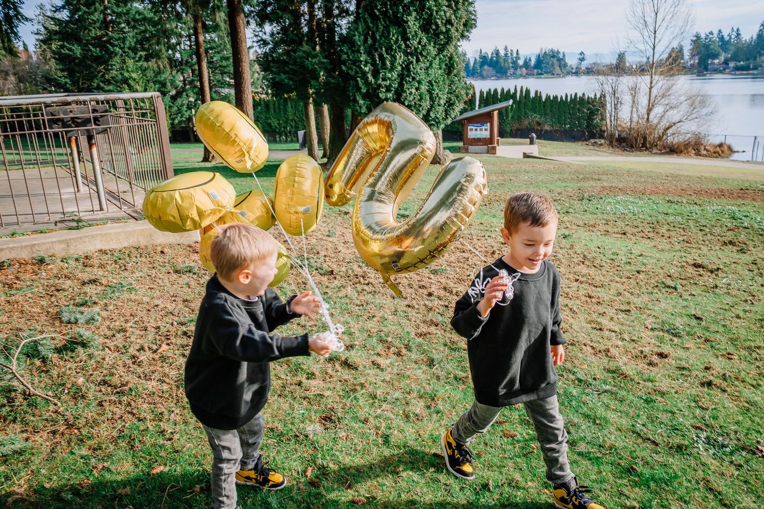 Young children running during a relaxed family photography session in SeaTac, between Seattle and Tacoma, Washington.