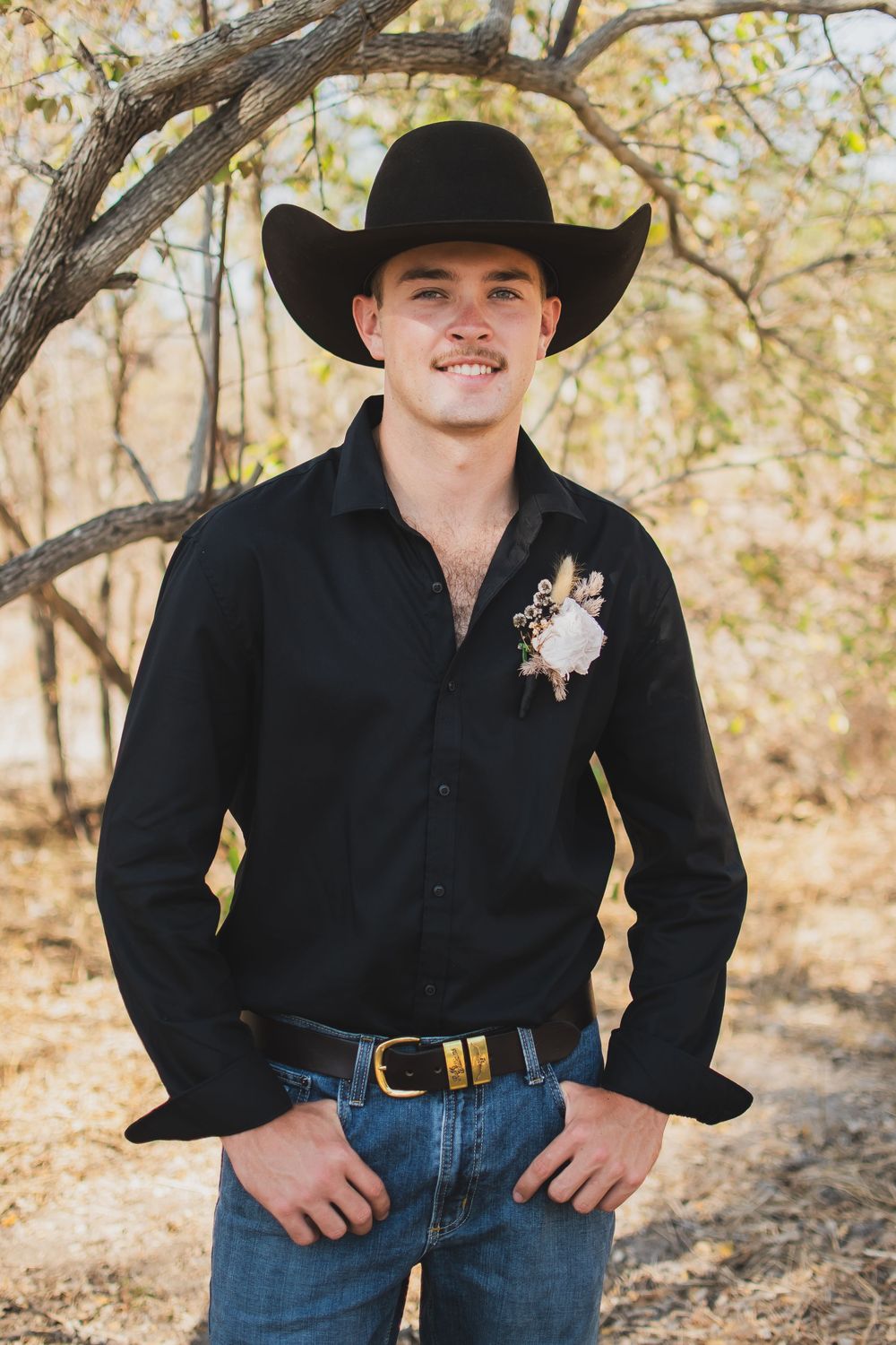 Three western-style portraits show someone in a black shirt, jeans and cowboy hat posing against an autumn forest backdrop.