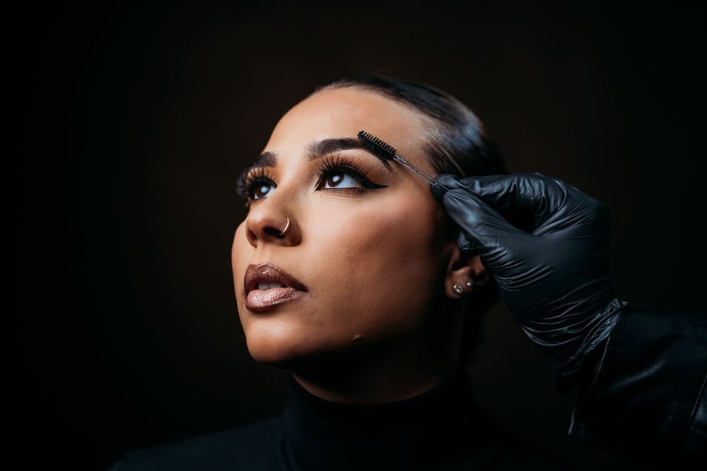 Artistic beauty portrait series showing different angles of face with dramatic makeup and lighting.