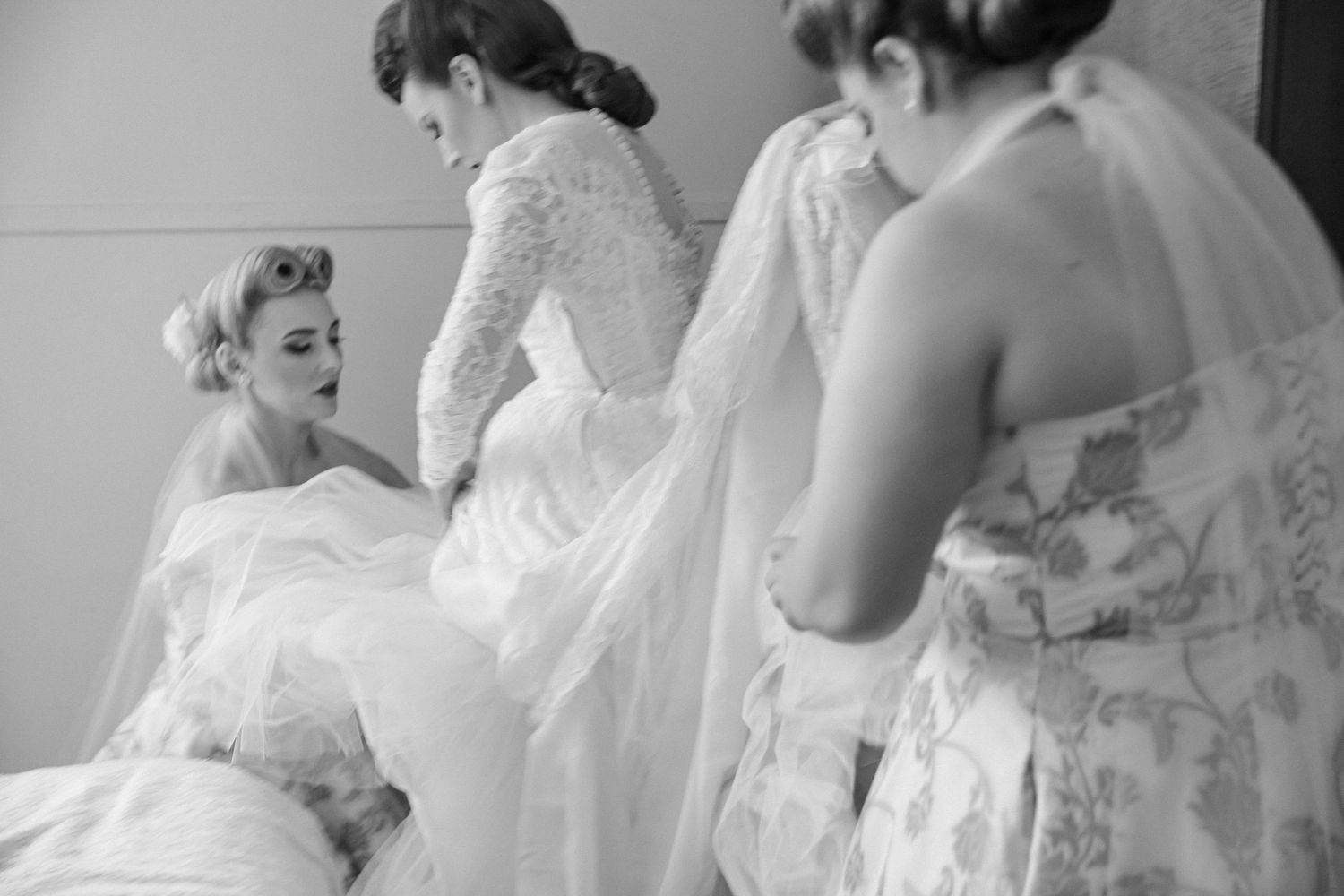 Bride’s wedding dress displayed on a vintage wardrobe in a rural NSW home before an intimate country wedding helped by bridesmaids.
