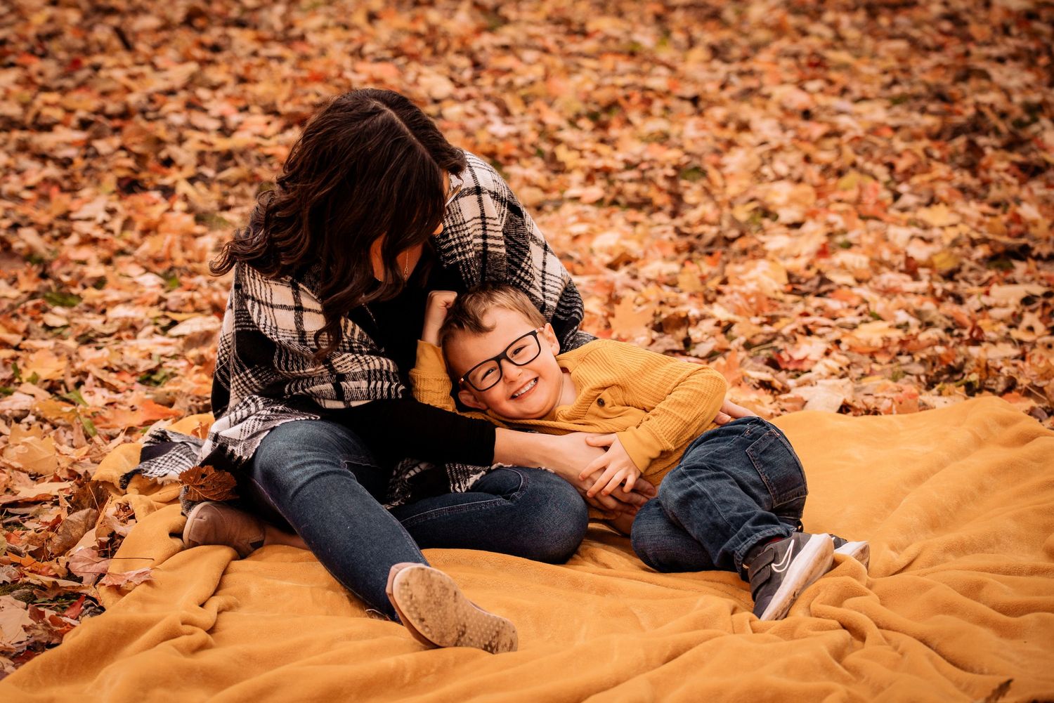 Mother and son photographed together during a fall family session in Brock Township, Ontario.
