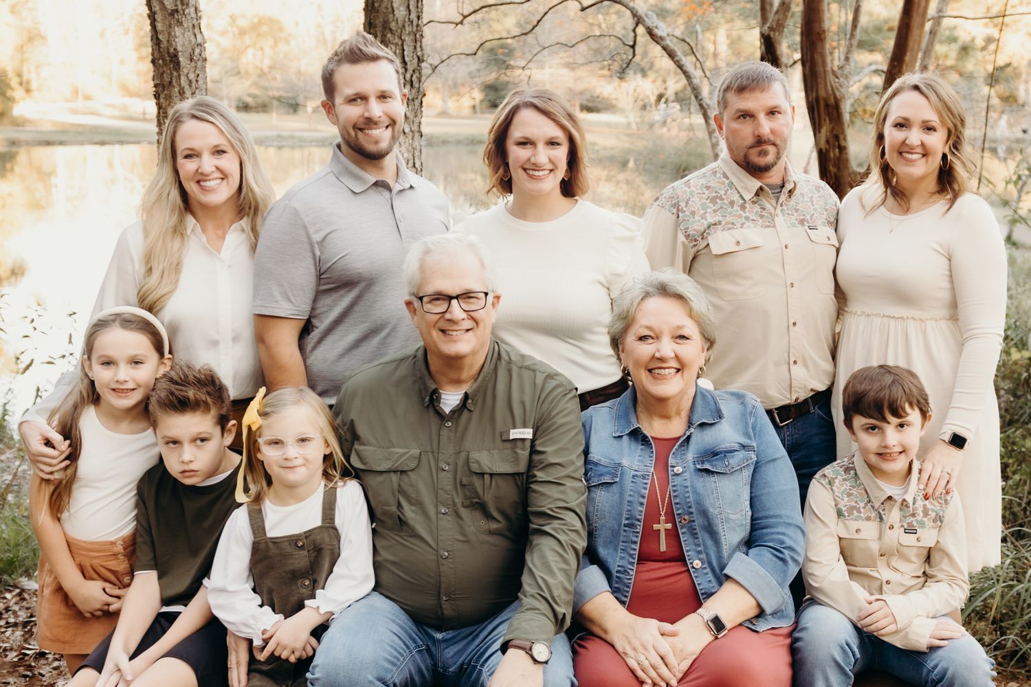 Extended family portrait session with multiple generations posed together outdoors.