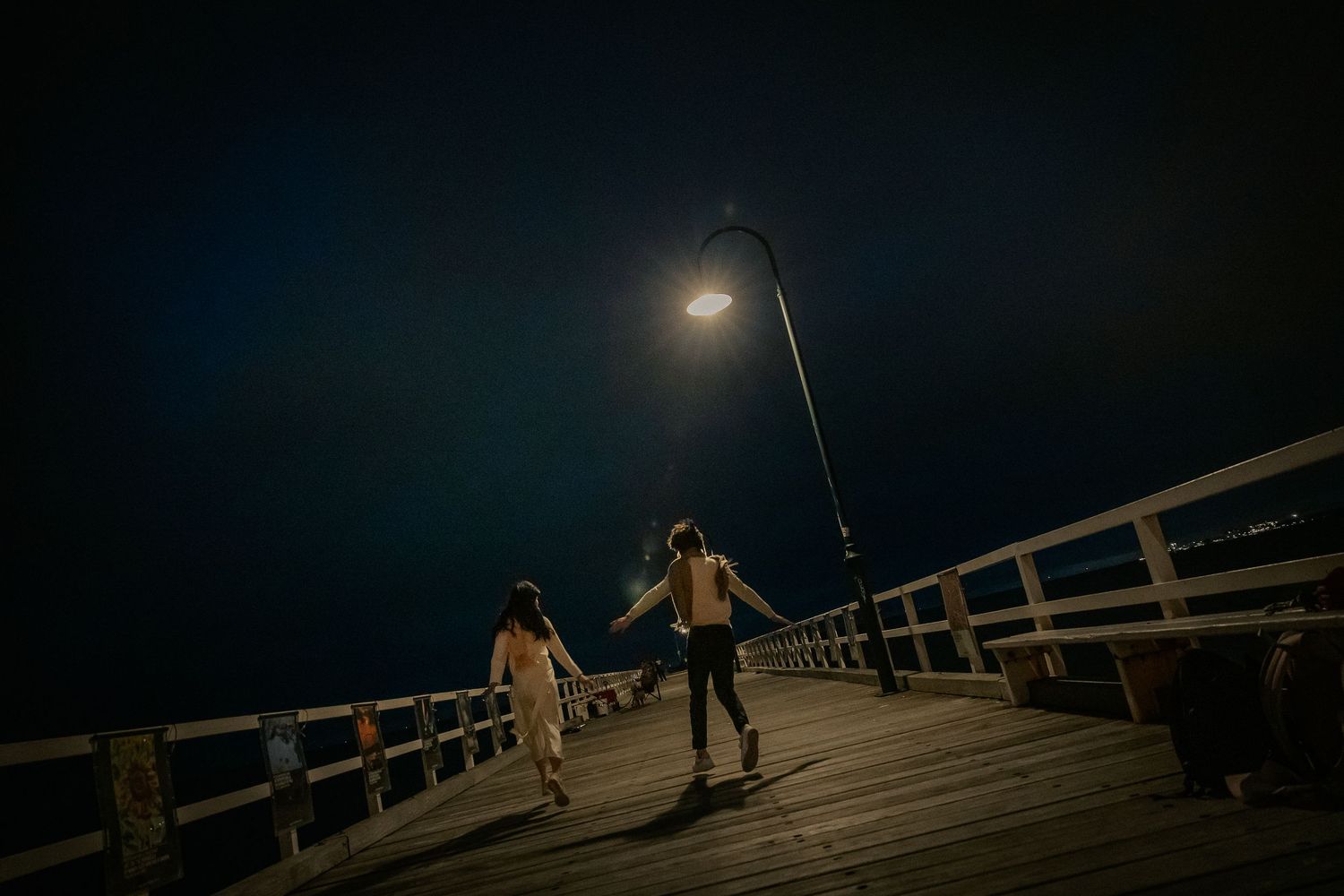 Cinematic seaside engagement photography at Port Melbourne Pier
