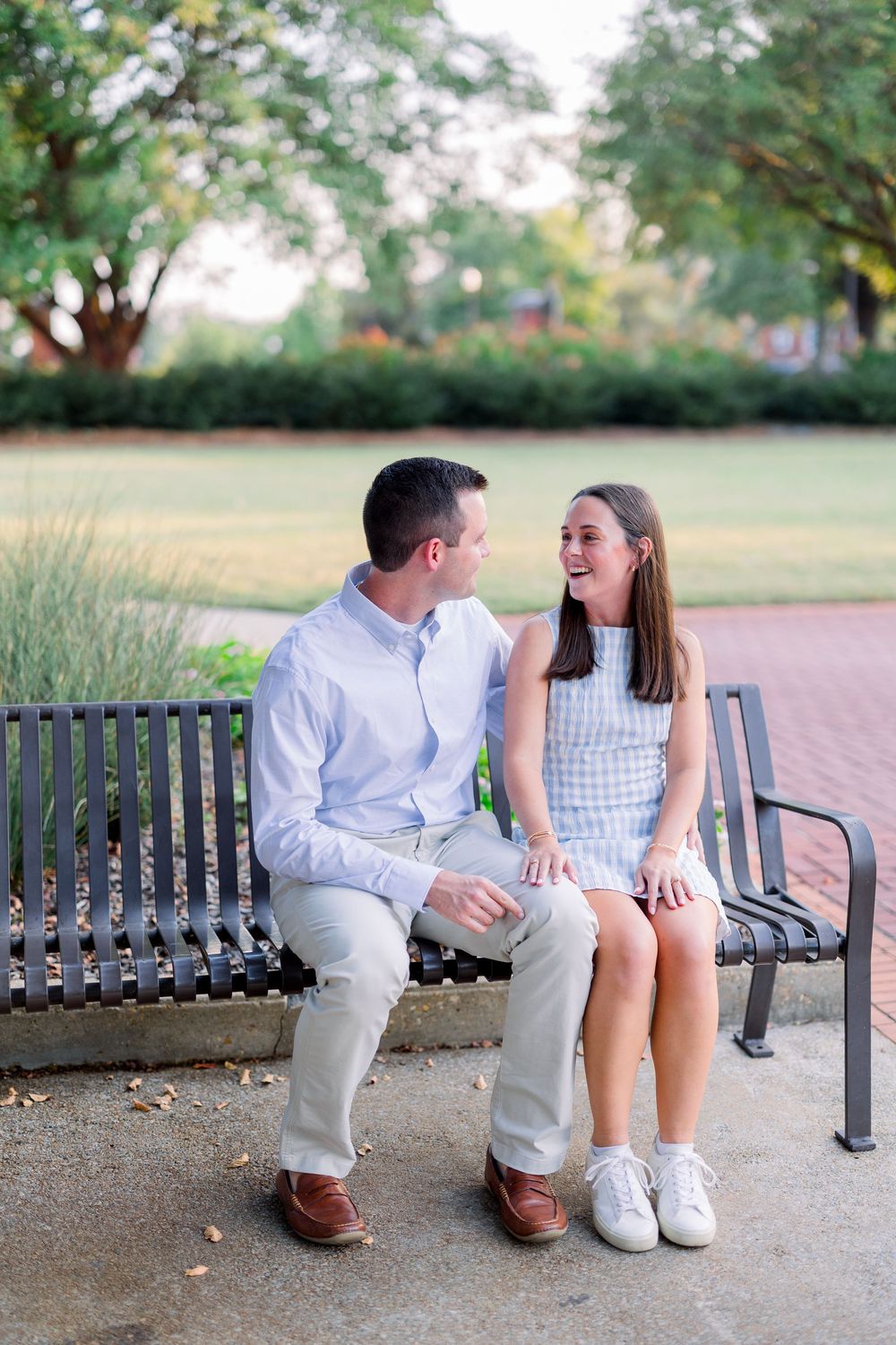 A couple sits together on a park bench in casual white and blue summer attire, shown in a series of intimate moments.