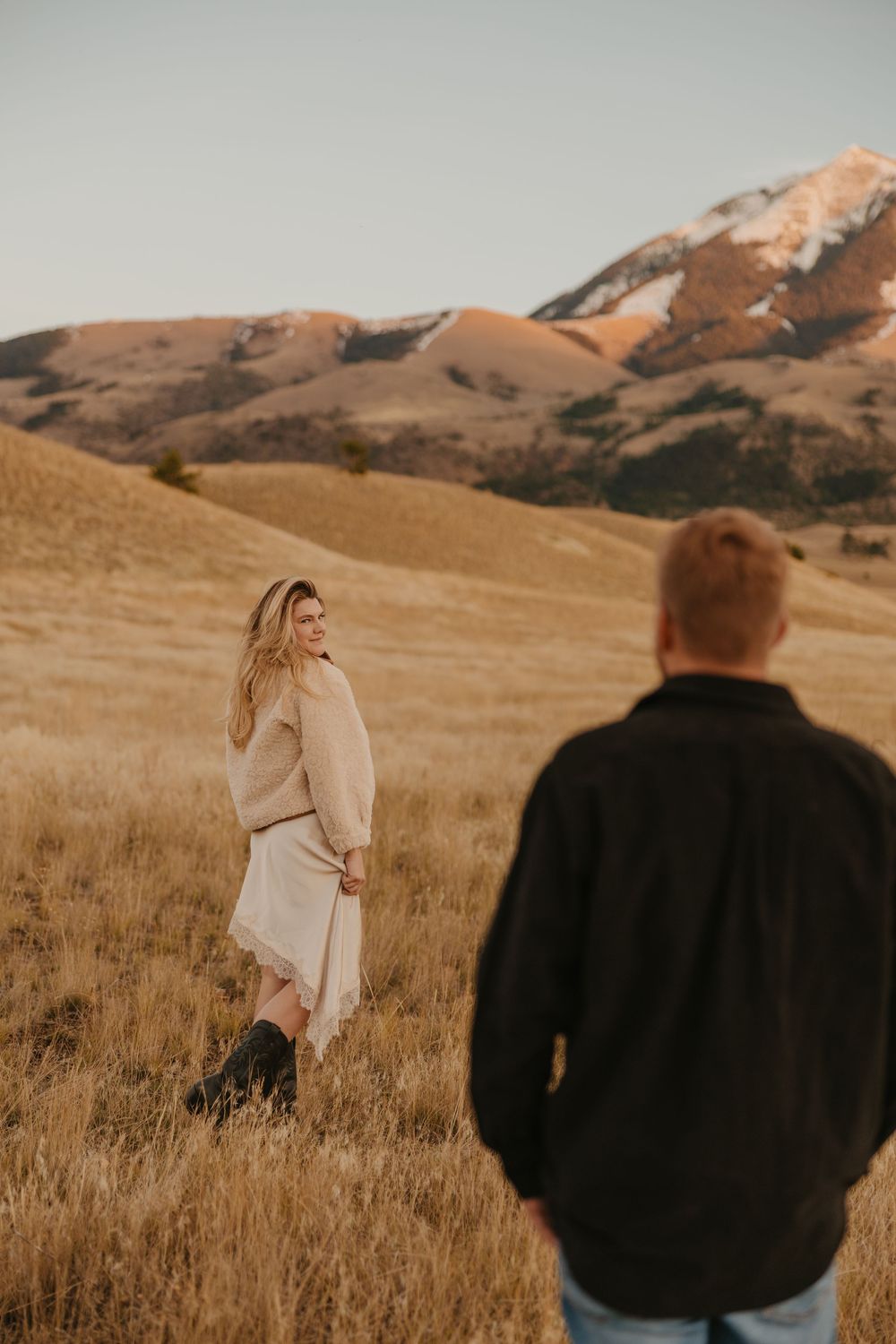 Western women shows off her dress in Paradise valley for their engagement photos captured by Montana Photographer in Livingston, Montana