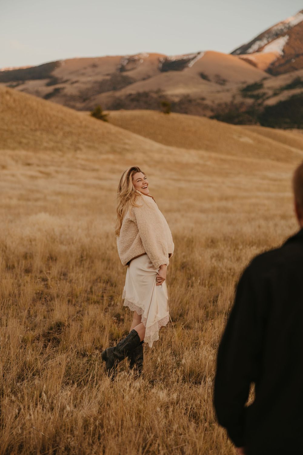 Western women shows off her dress in Paradise valley for their engagement photos captured by Montana Photographer in Livingston, Montana