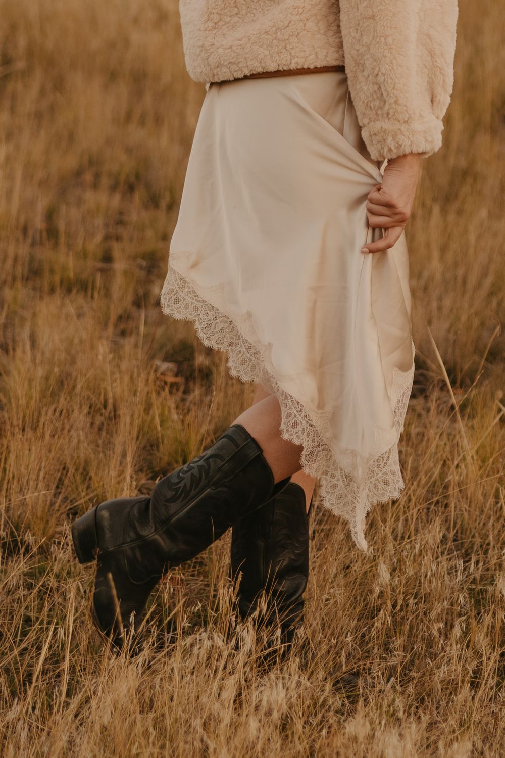 Western women shows off her dress in Paradise valley for their engagement photos captured by Montana Photographer in Livingston, Montana