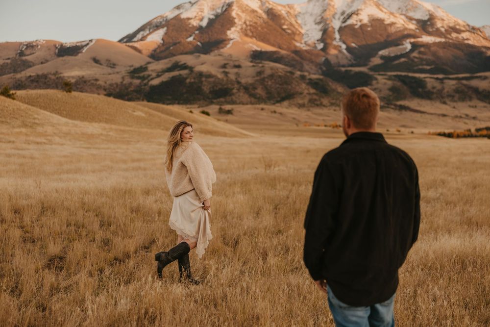 Western women shows off her dress in Paradise valley for their engagement photos captured by Montana Photographer in Pray, Montana