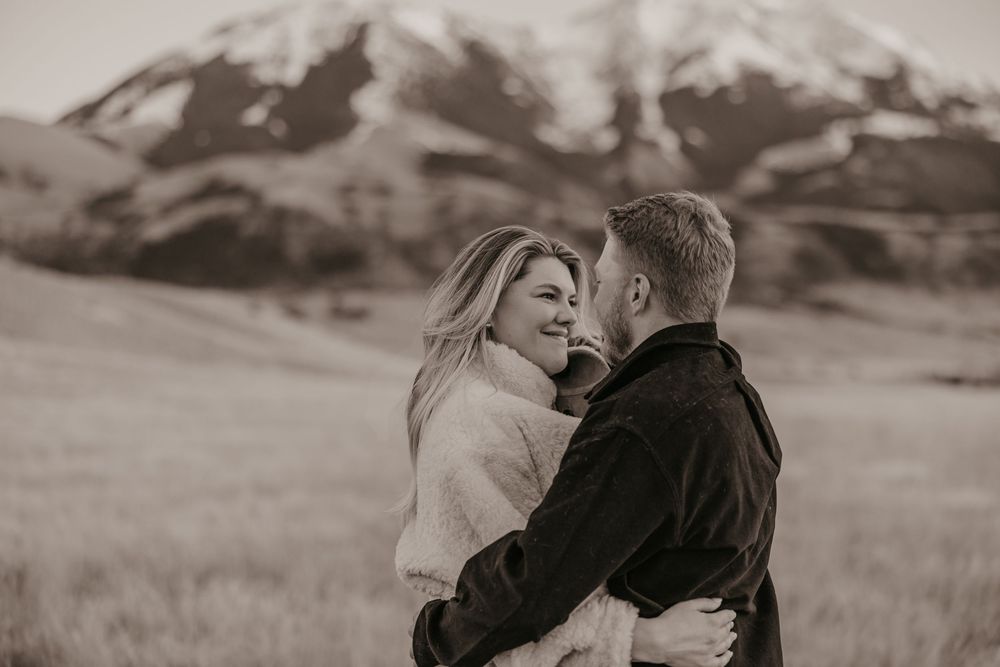 Western couple dances under the mountains in Paradise valley for their engagement photos captured by Montana Photographer in Pray, Montana