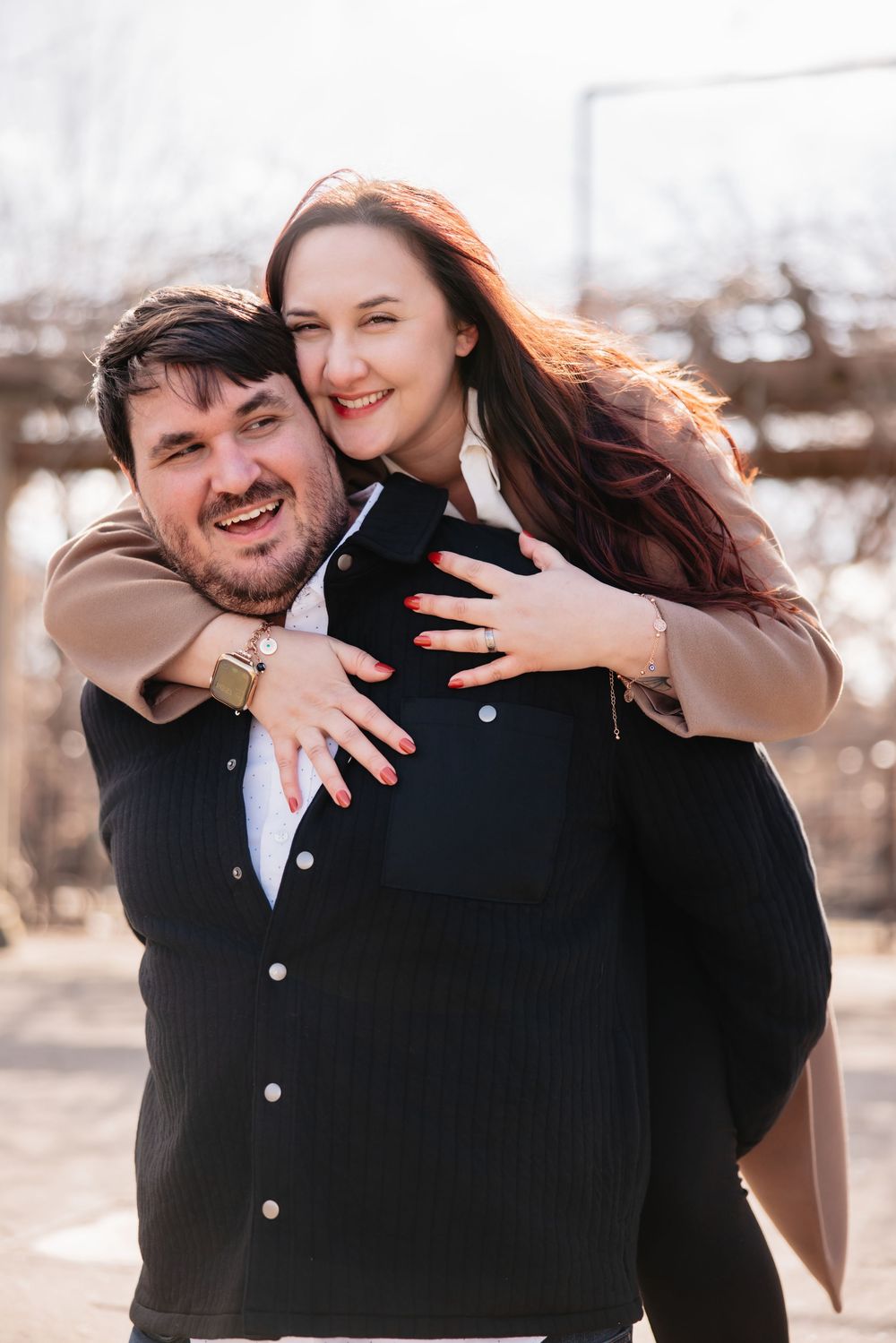A joyful engagement photoshoot sequence showing a couple embracing and laughing together outdoors.
