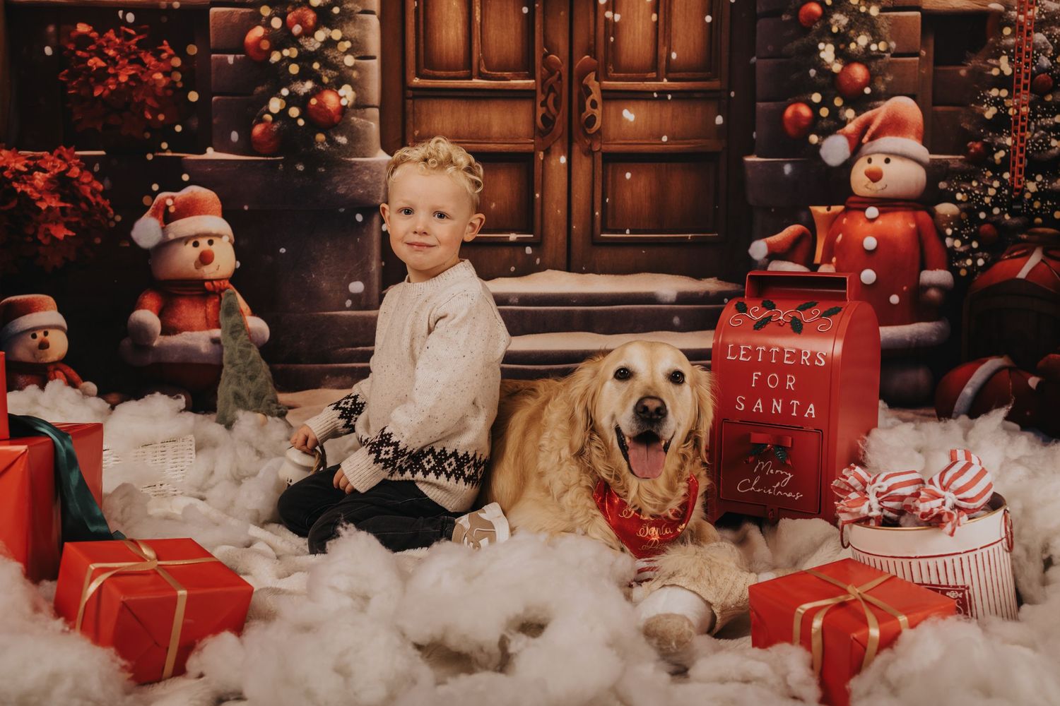 A festive Christmas scene with a golden retriever among wrapped presents, Santa decorations, and snowy white decor.