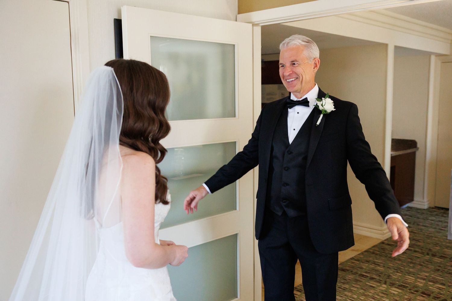 Bride with father on wedding day.